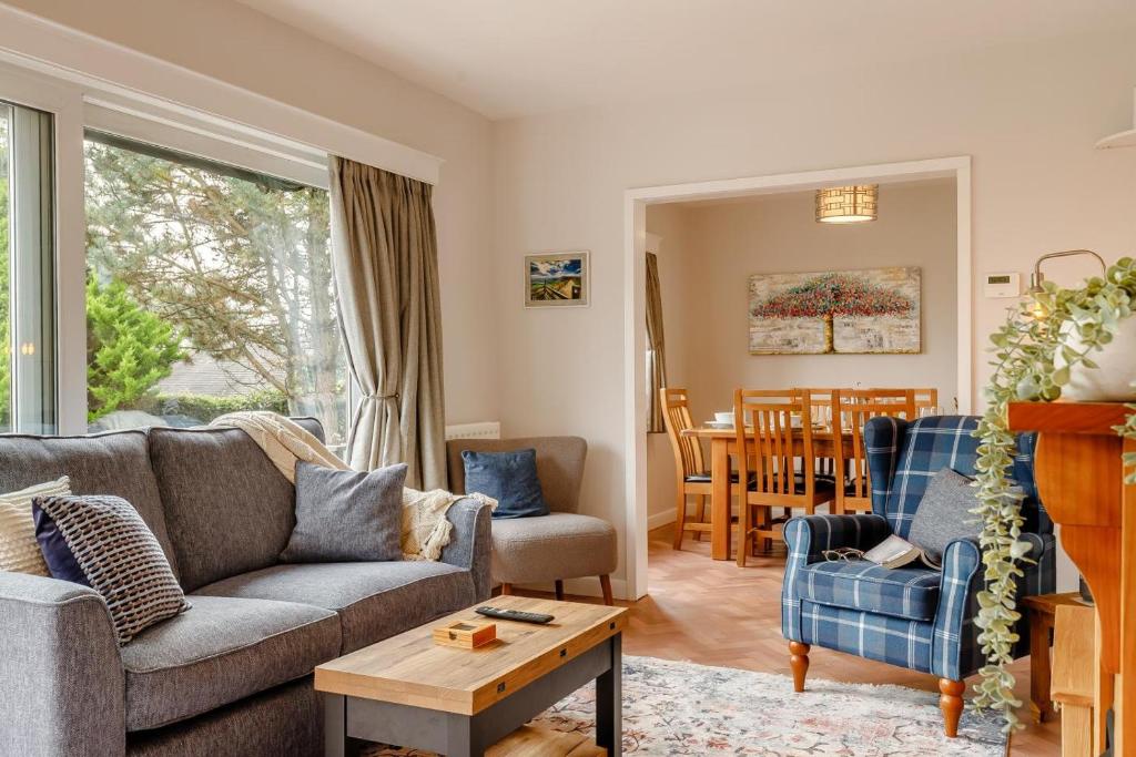 a living room with a couch and chairs and a table at 3 Bed in Ashbourne oc-e27970 in Ashbourne