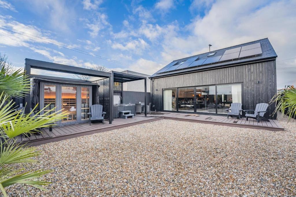 a contemporary house with a glass roof and a patio at 2 Bed in Lancing oc-t29902 in Lancing