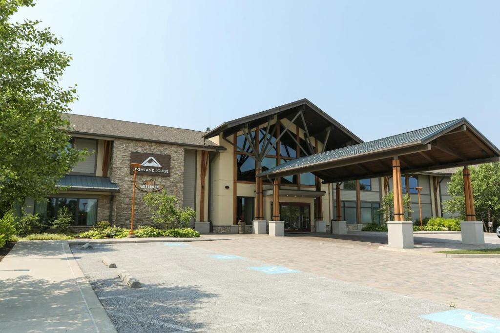 a building with birds standing outside of it at Liberty Mountain Lodging by Vail Resorts in Fairfield