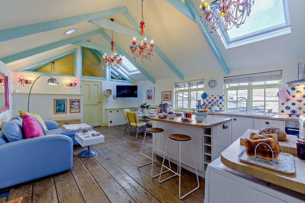 a kitchen and living room with a couch and a table at 1 Bed in St. Ives oc-e28023 in St Ives