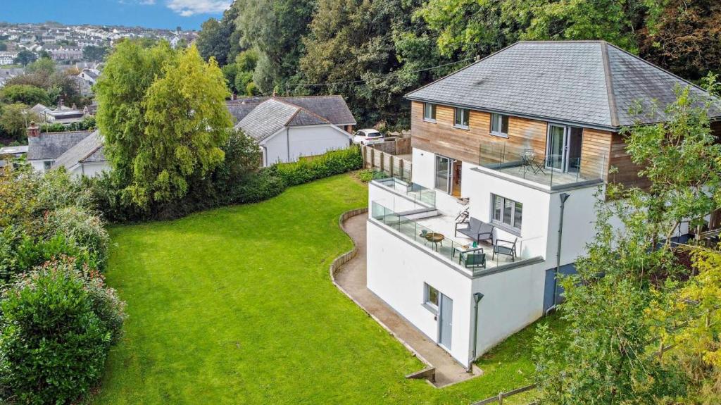 an aerial view of a house with a green yard at 4 Bed in Wadebridge oc-l30127 in Wadebridge