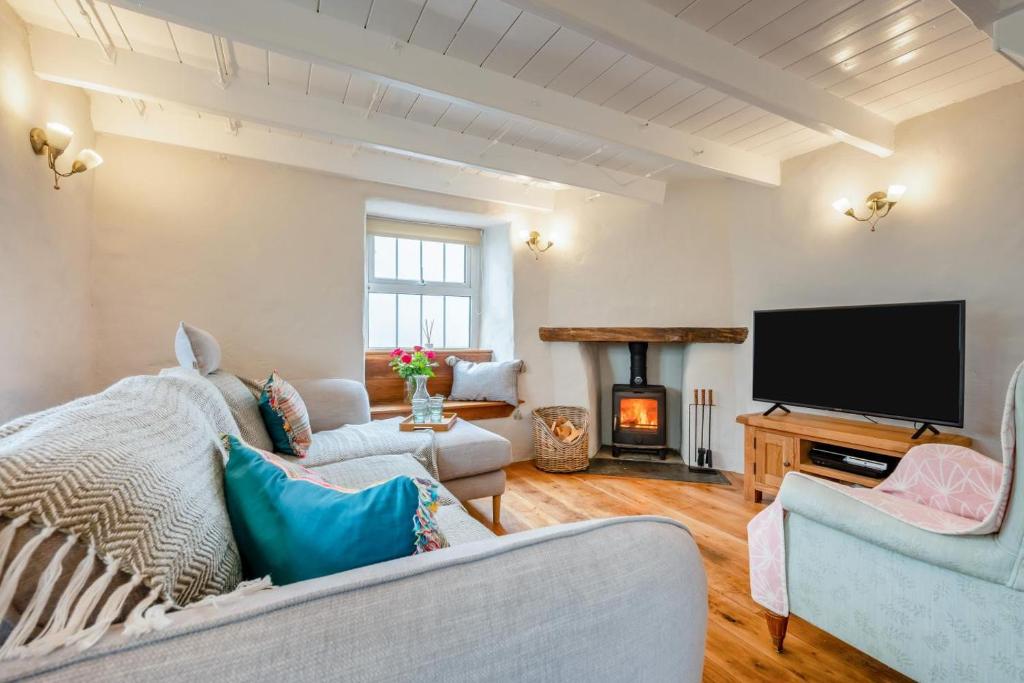 a living room with a couch and a television at 3 Bed in Egloshayle oc-m32201 in Egloshayle