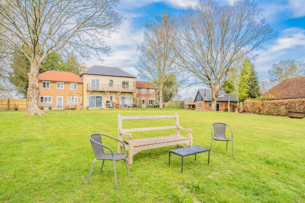 a park with a bench and two chairs in the grass at 5 Bed in Battle oc-c31779 in Battle