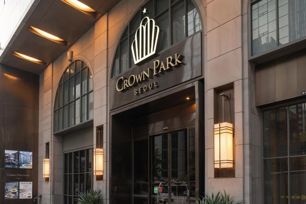 a store front of a building with a sign on it at Crown Park Hotel Seoul Myeongdong in Seoul