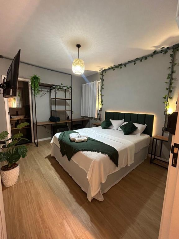 a bedroom with a large bed in a room at Vibe Amazon in Manaus