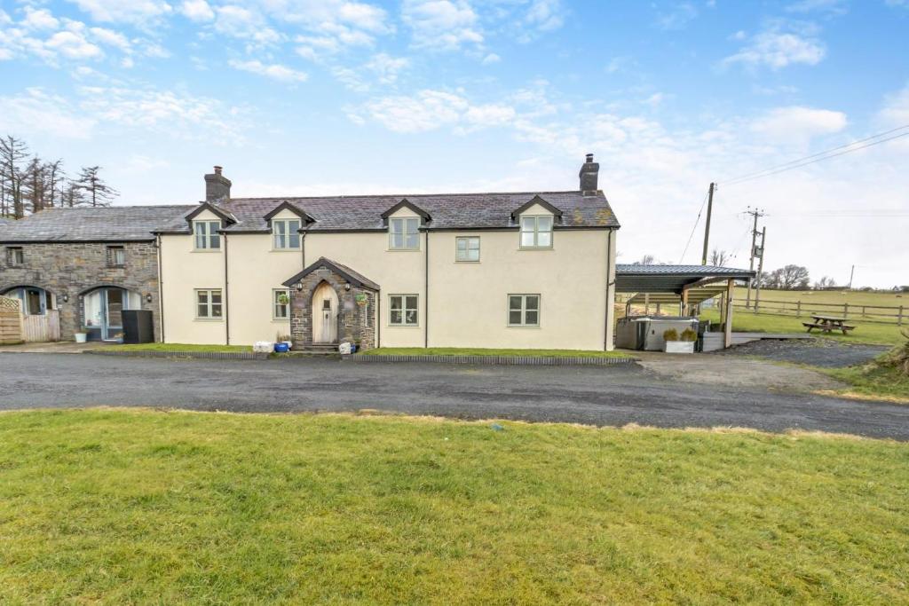 a large house with a grassy field in front of it at 5 Bed in Devils Bridge oc-t13712 in Devils Bridge