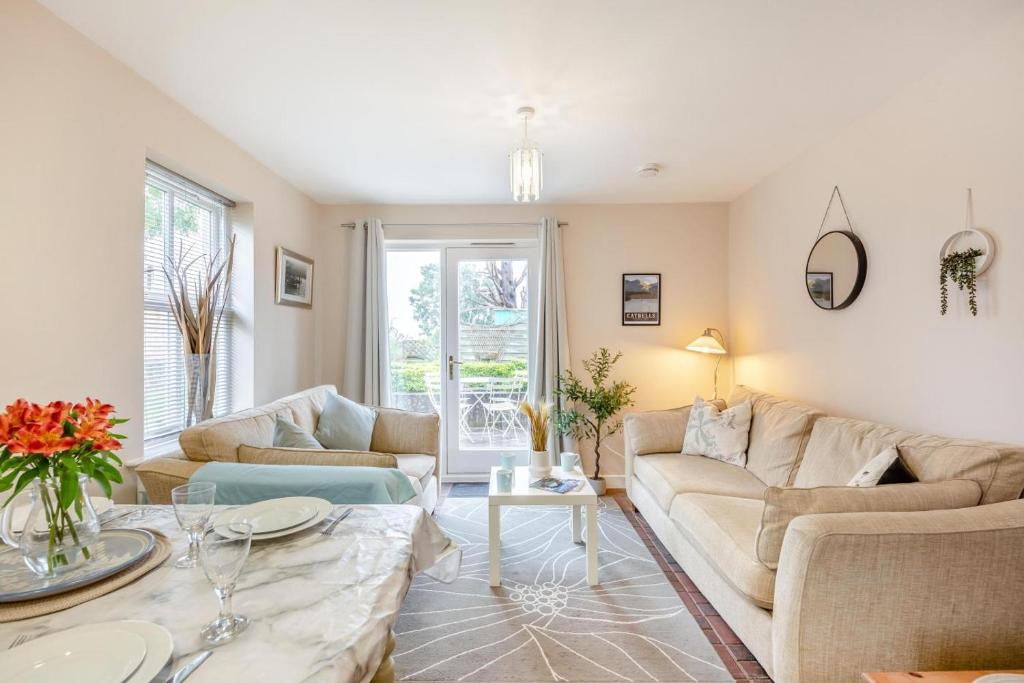 a living room with two couches and a table at 2 Bed in Aspatria oc-p32645 in Aspatria