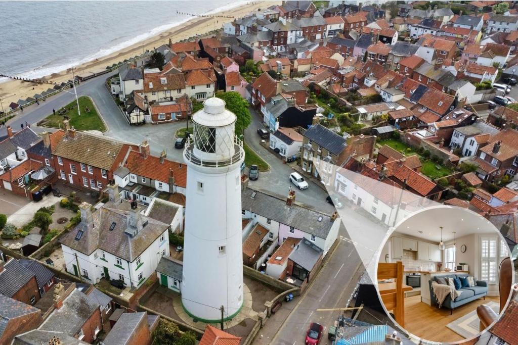 an aerial view of a lighthouse in a city at 2 Bed in Southwold oc-hdoubl in Southwold