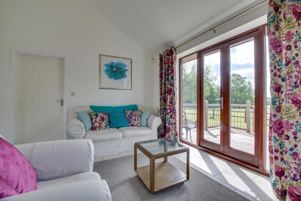 a living room with a couch and a window at 1 Bed in Rolvenden oc-tn612 in Rolvenden