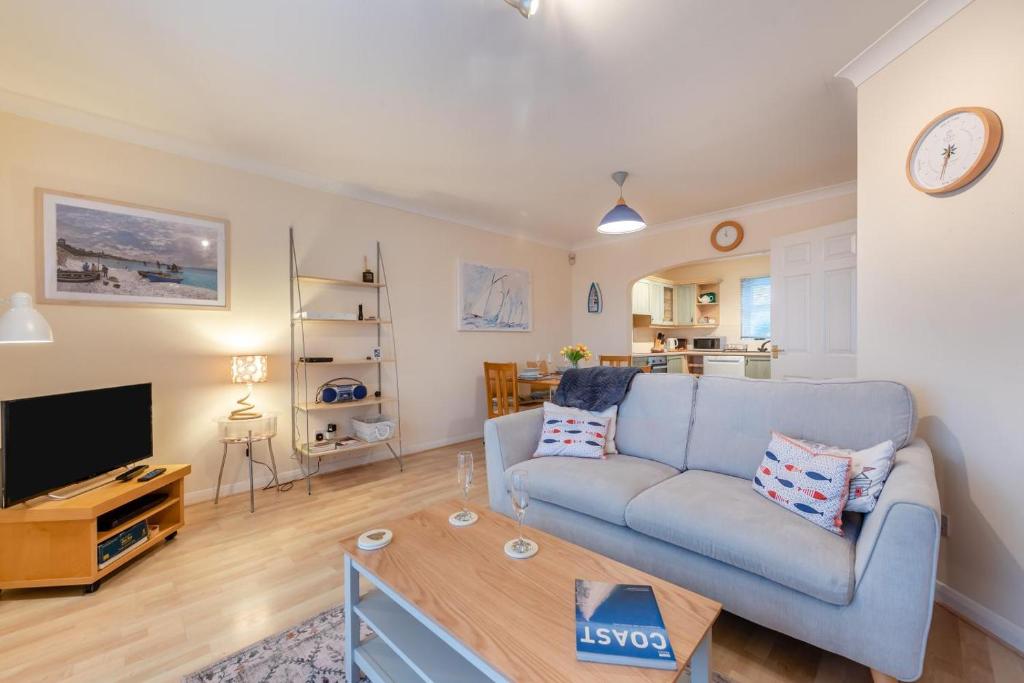 a living room with a couch and a table at 3 Bed in Broad Haven oc-t30529 in Broad Haven