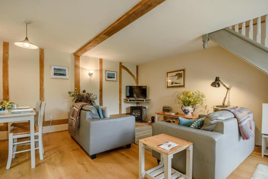 a living room with a couch and a table at 2 Bed in Rumburgh oc-dgf in Rumburgh