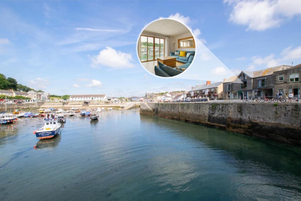a house on a river with boats in the water at 2 Bed in Porthleven oc-4stelv in Porthleven
