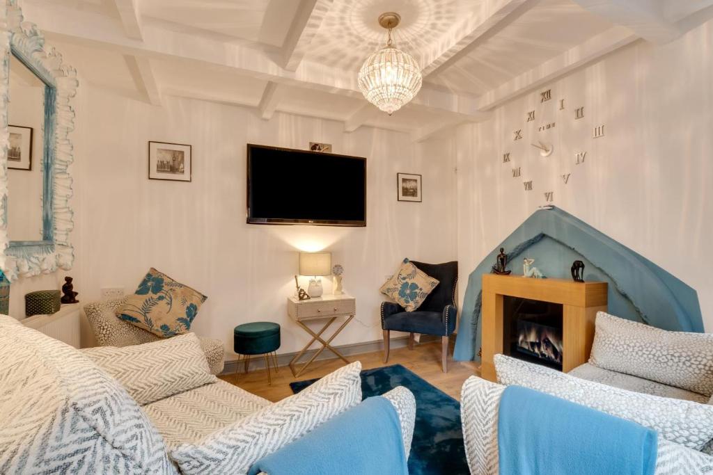 a living room with a bed and a fireplace at 2 Bed in Whitby oc-r563 in Robin Hood's Bay