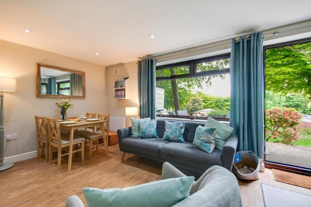a living room with a couch and a table at 2 Bed in Weybourne oc-2151 in Weybourne
