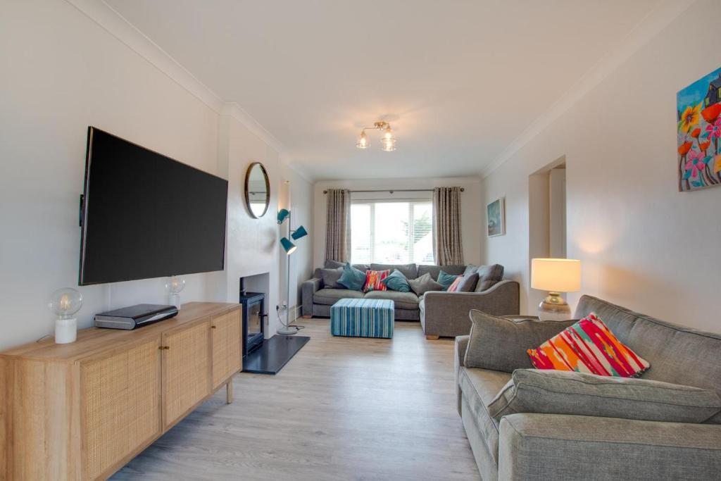 a living room with a large flat screen tv at 3 Bed in Greatstone oc-ek777 in Littlestone-on-Sea