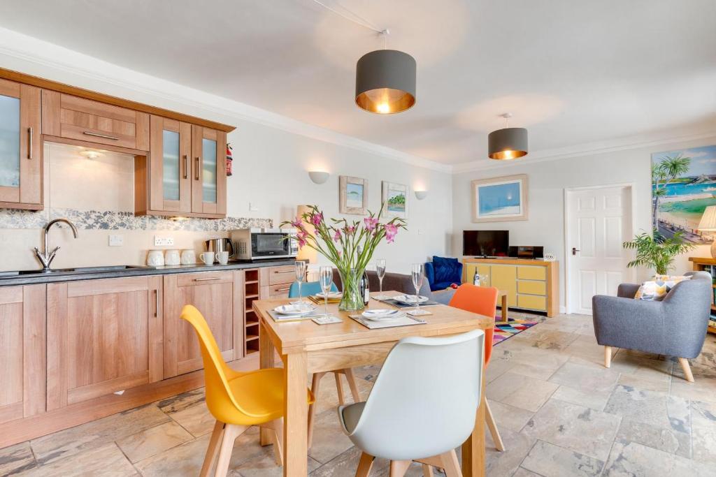a kitchen and living room with a table and chairs at 2 Bed in Marazion oc-p00598 in Marazion