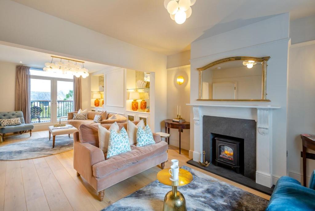 a living room with a couch and a fireplace at 6 Bed in Abersoch oc-c29569 in Abersoch