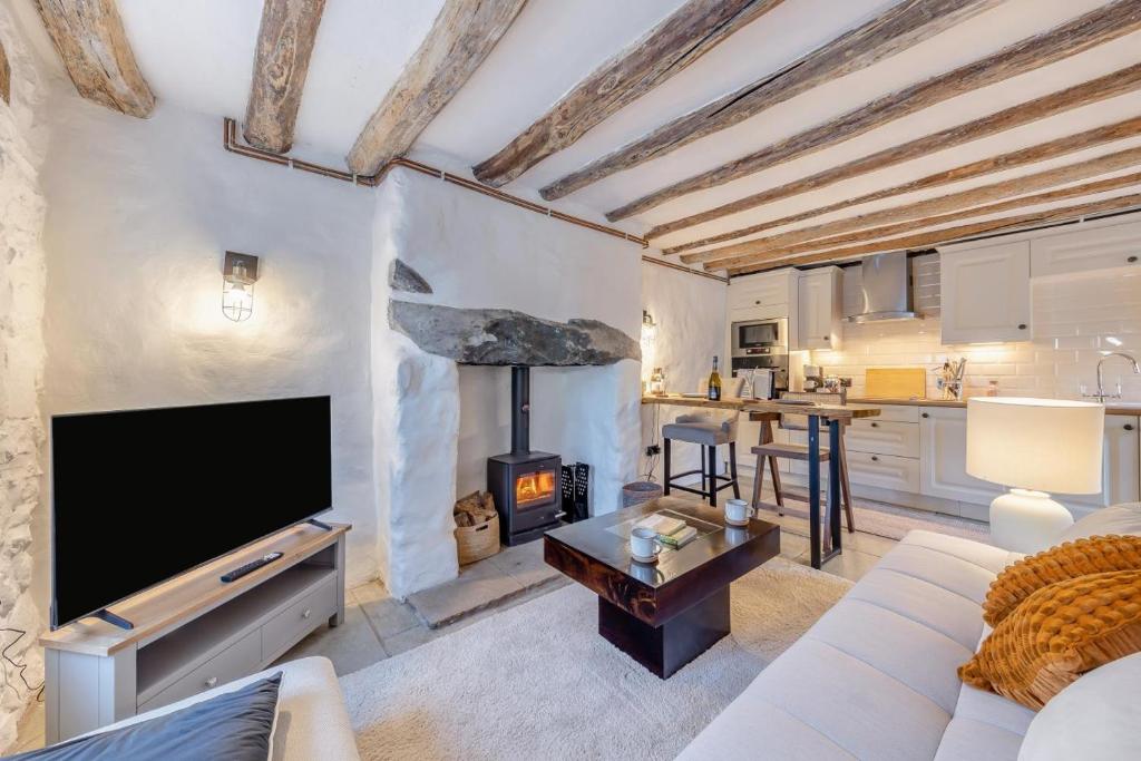 a living room with a tv and a fireplace at 1 Bed in Harlech oc-t32043 in Harlech