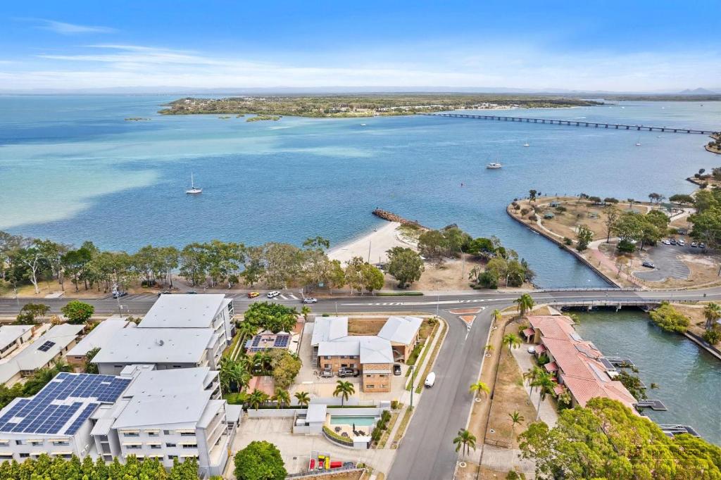 an aerial view of a city and a body of water at Cloud 8 on Welsby in Bongaree
