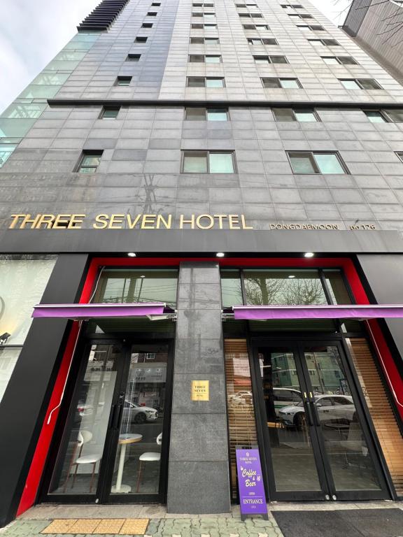 a building with the sign for a three seven hotel at Three Seven Hotel Dongdaemun in Seoul