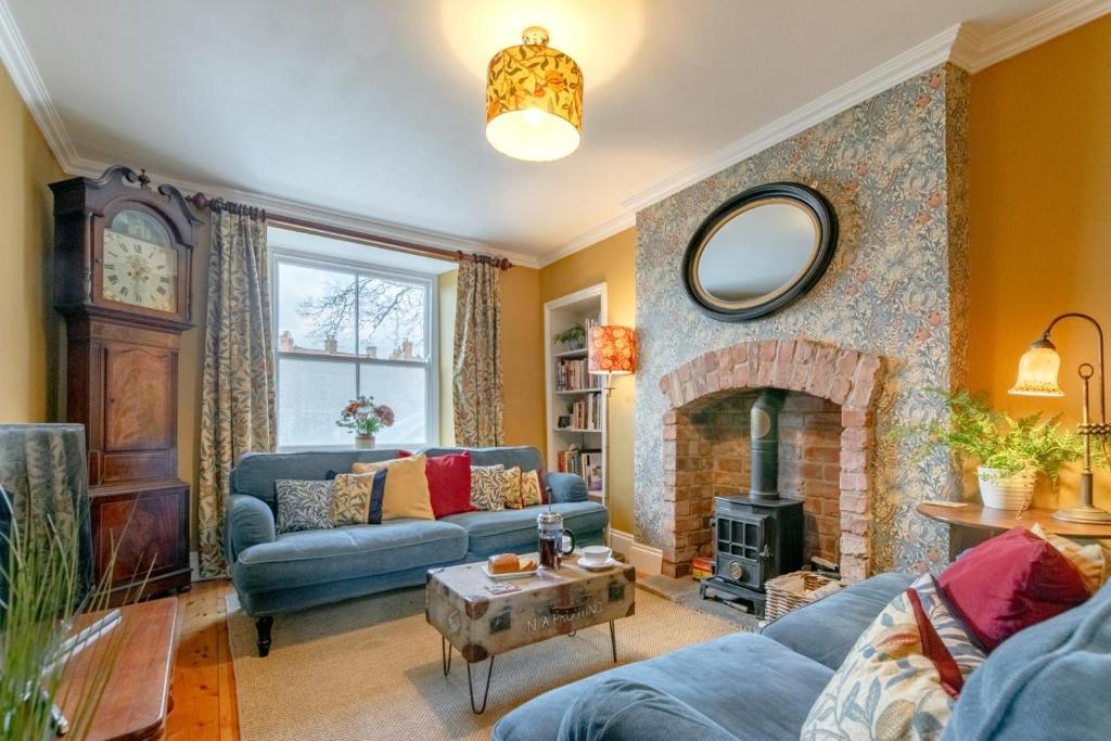 a living room with a couch and a fireplace at 2 Bed in Pickering oc-y110 in Pickering