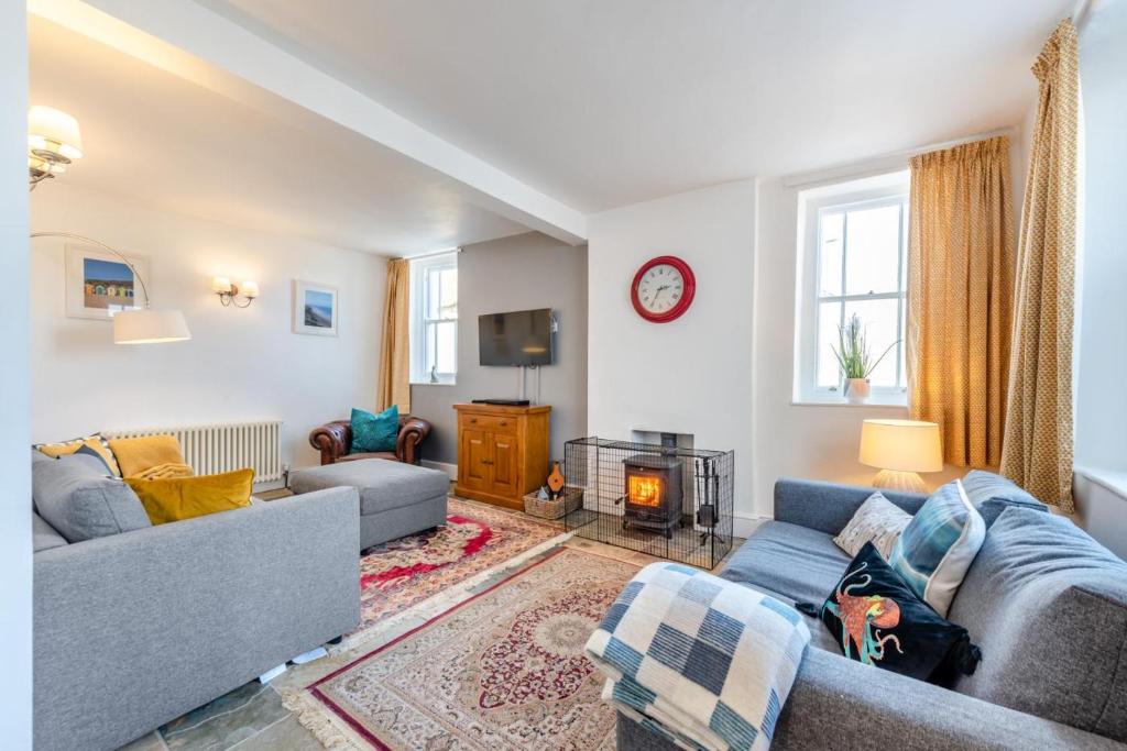 a living room with two couches and a fireplace at 3 Bed in Braunton oc-soufar in Braunton