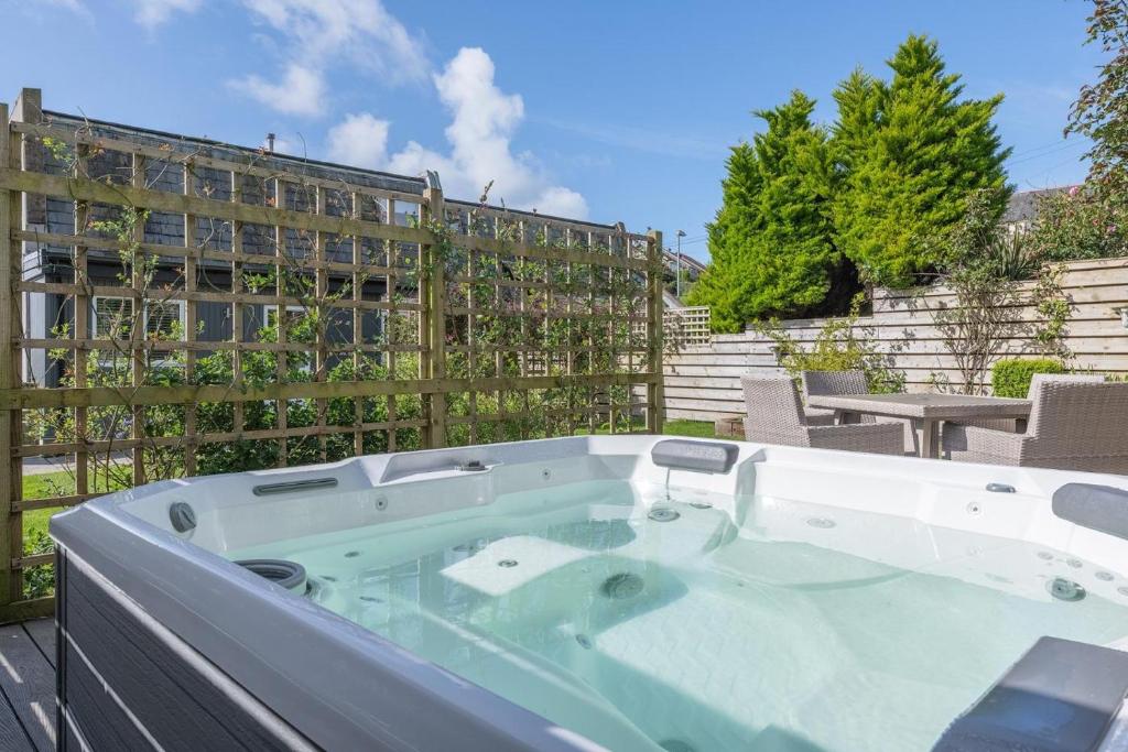 a jacuzzi tub sitting on top of a patio at 3 Bed in Aberdovey oc-n29124 in Aberdyfi