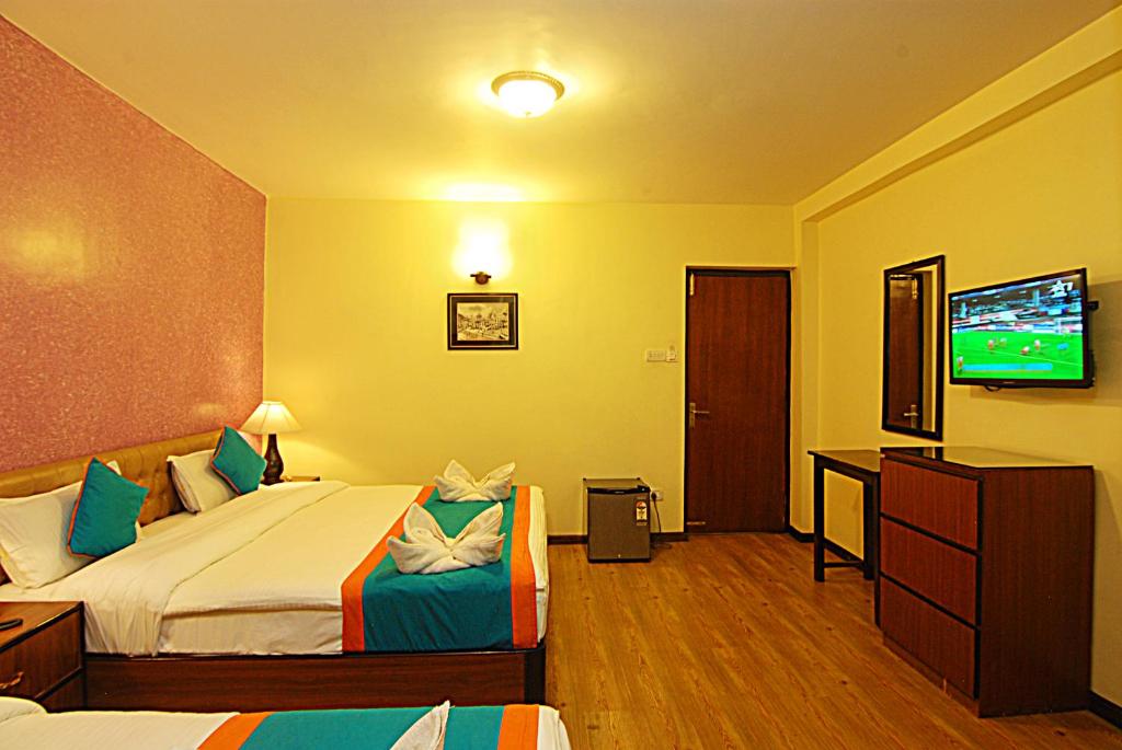 TV a/nebo společenská místnost v ubytování Hotel Amaryllis