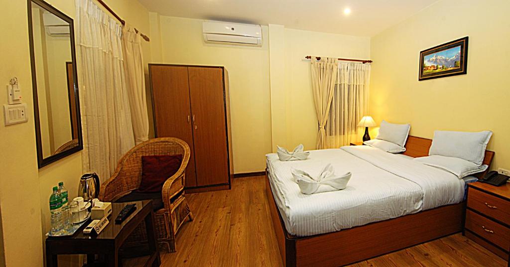 Postel nebo postele na pokoji v ubytování Hotel Amaryllis
