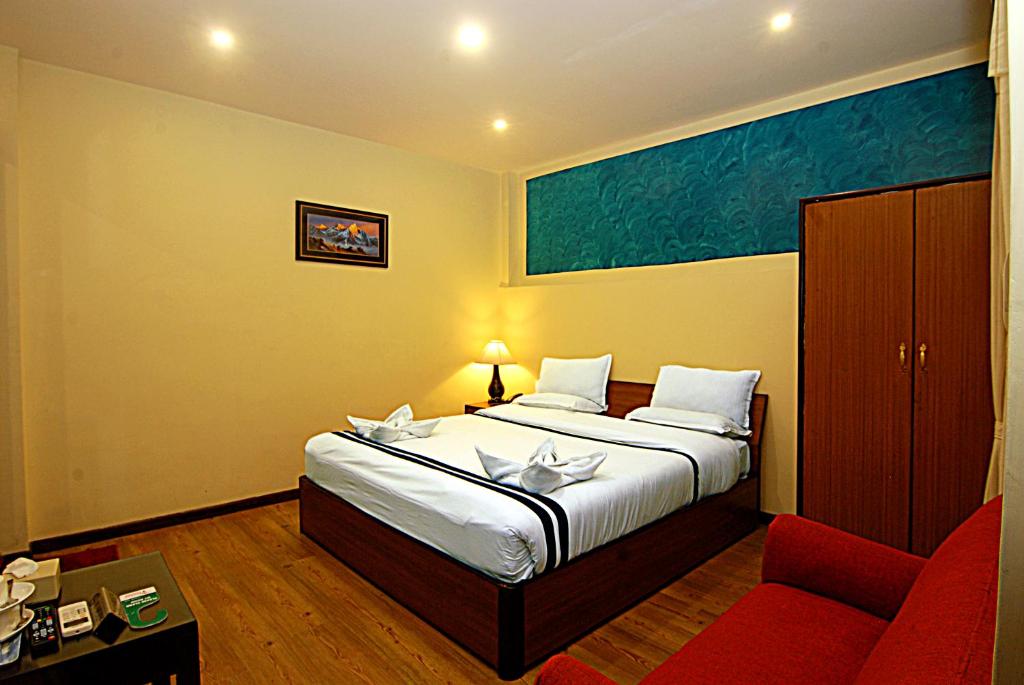 Postel nebo postele na pokoji v ubytování Hotel Amaryllis