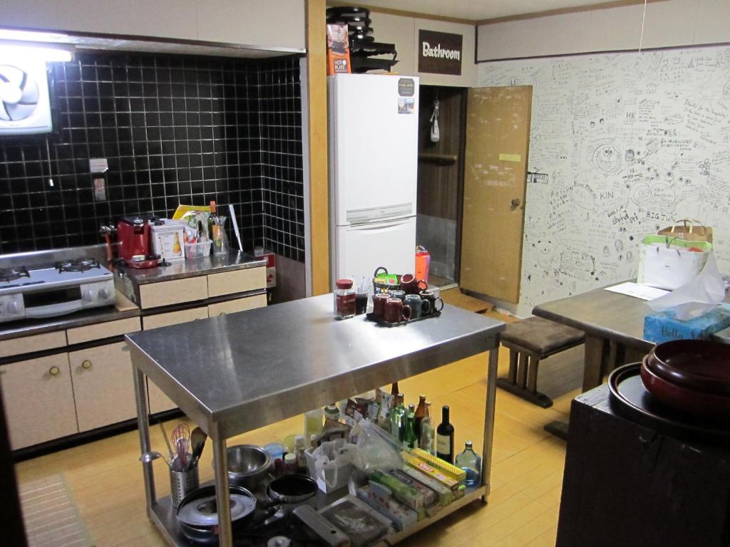 Kuchyň nebo kuchyňský kout v ubytování Guest House Enishi