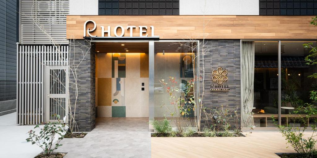 a store front of a building with a door at R Hotel Namba East in Osaka