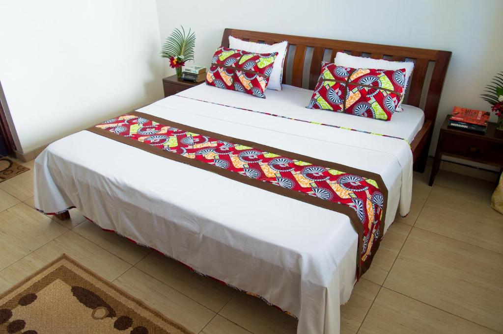 Postel nebo postele na pokoji v ubytování Paradise Resort Apartments