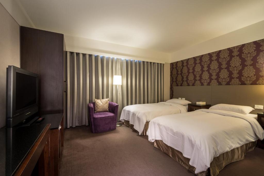 Postel nebo postele na pokoji v ubytování Delight Hotel