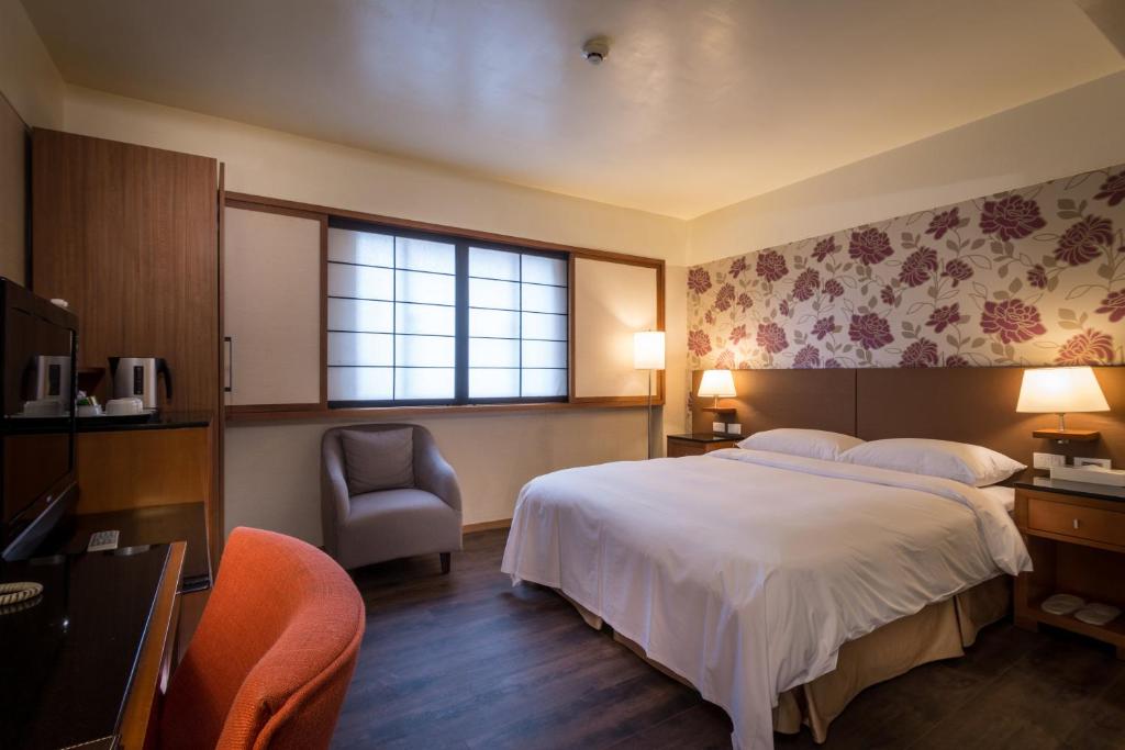 Postel nebo postele na pokoji v ubytování Delight Hotel