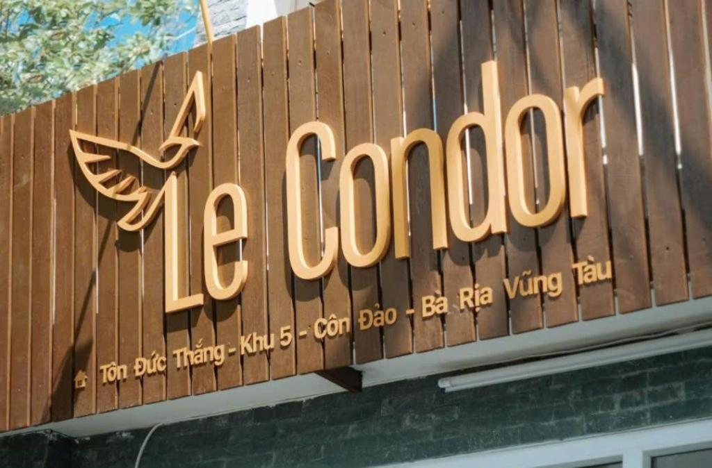 a sign for a la colombia on top of a building at Le Condor House and Café in Con Dao