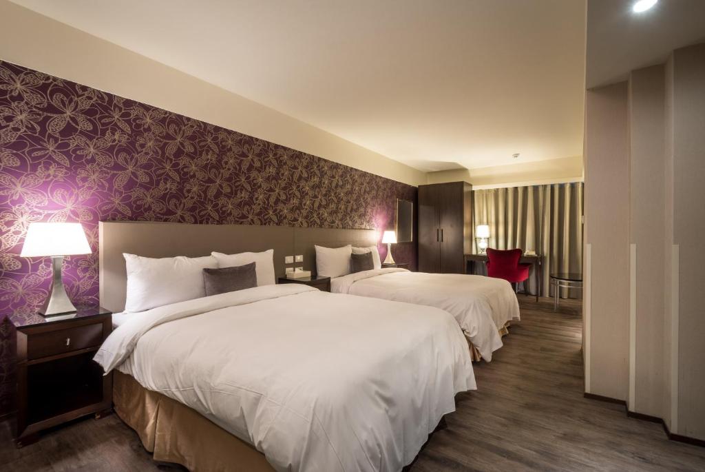 Postel nebo postele na pokoji v ubytování Delight Hotel