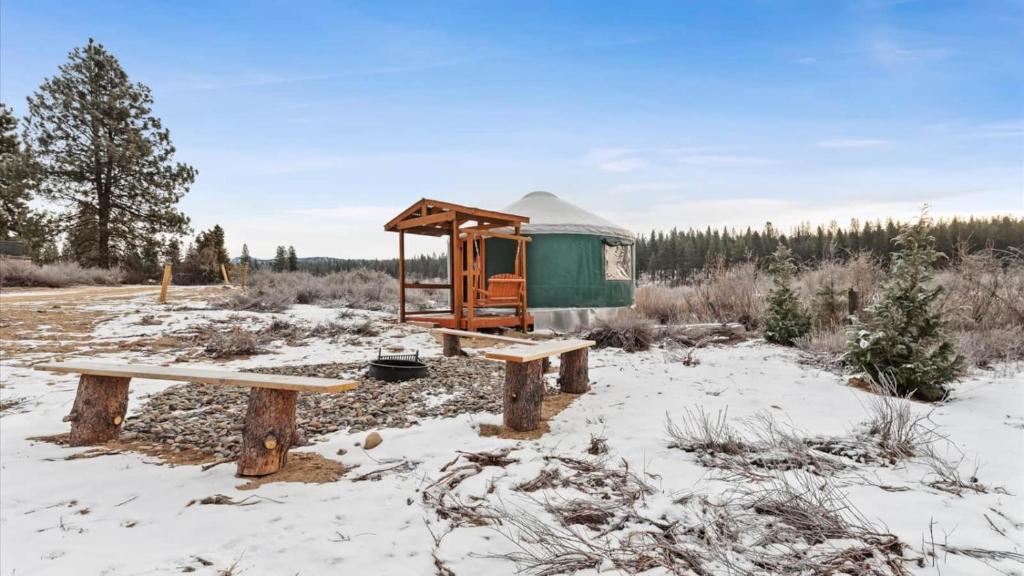 a gazebo and benches in the snow at Yurt 1 - The Prospector in Idaho City