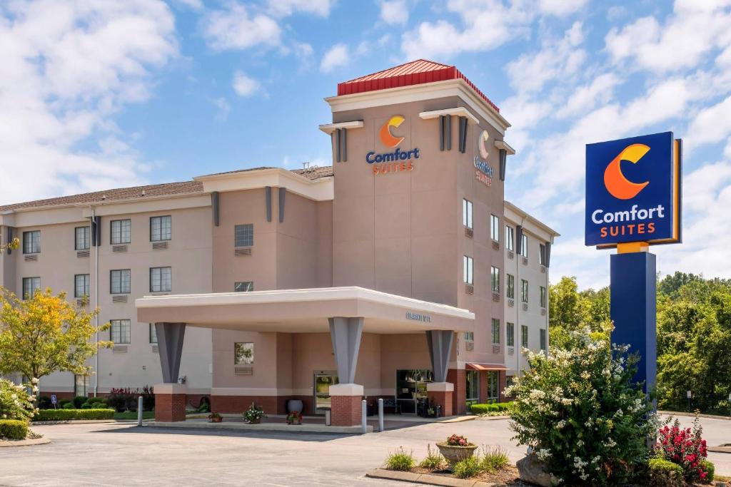 a hotel with a sign in front of a building at Comfort Suites Elizabethtown in Elizabethtown