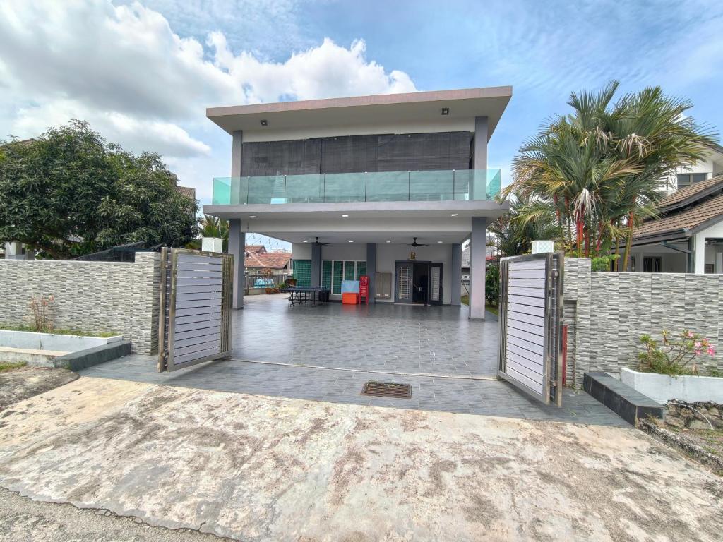a house with two gates in front of it at Together Hideaway Cheras 22pax 5R4B KTV, BBQ, ARCADE GAMES CHINESE, MALAY ONLY in Cheras