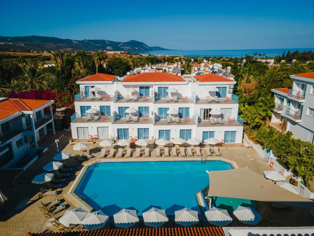an aerial view of a hotel with a swimming pool at Greek Village - Latchi הכפר היווני - כשר in Polis Chrysochous