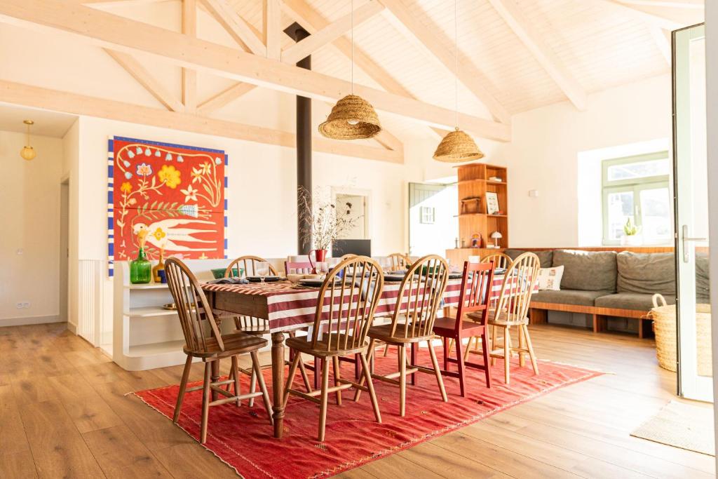 a dining room with a table and chairs at Just Like Home - Casa da Tuca in Moledo