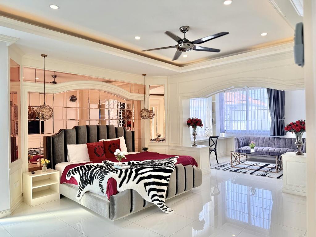 a zebra themed bedroom with a bed and a ceiling at Pool Villa Pattaya 5BD - Exquisite Pool Villa G in Nong Prue