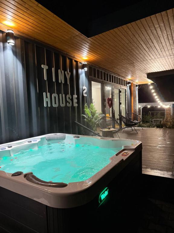 a jacuzzi tub in the middle of a building at Tiny House by the forest “2” in Borod