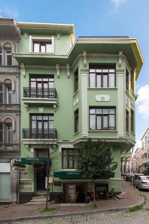a green building on a city street at Dareyn Boutique in Istanbul
