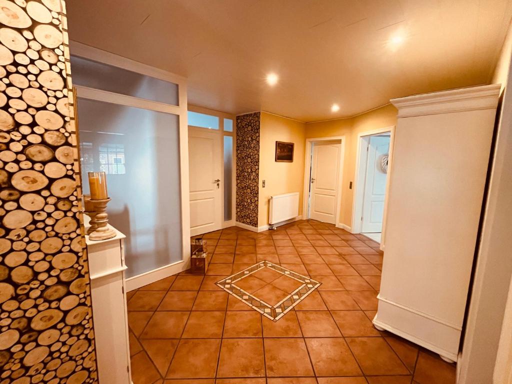 a hallway of a home with a room with a fireplace at Ferienwohnung Dietje in Stedesdorf