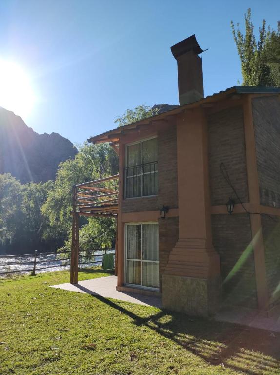 a building with a chimney on the side of it at Cabaña Cerro Lindo in San Rafael