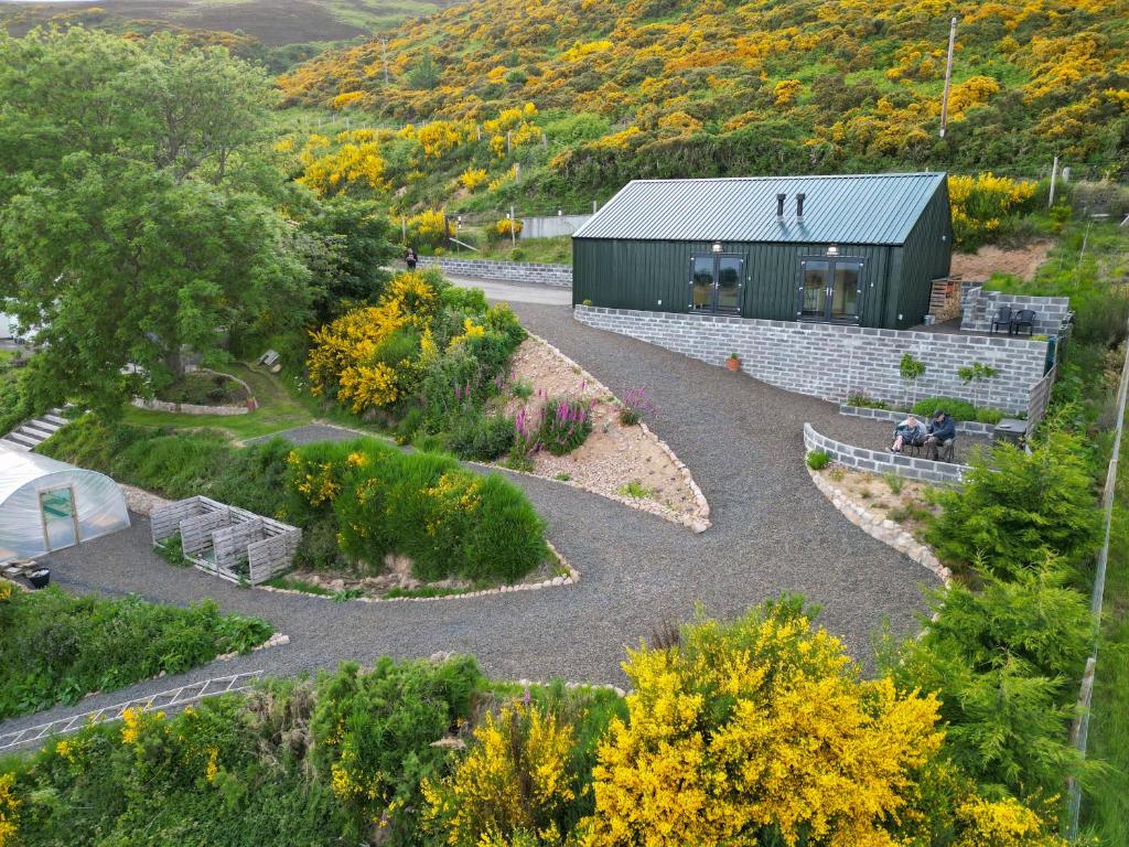 an overhead view of a garden with a building at Lothmore Lookout - Sunset in Kilmote