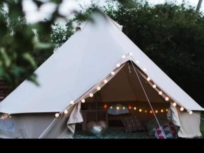 a white tent with lights on top of it at Wildberry glamping in Orgères-la-Roche