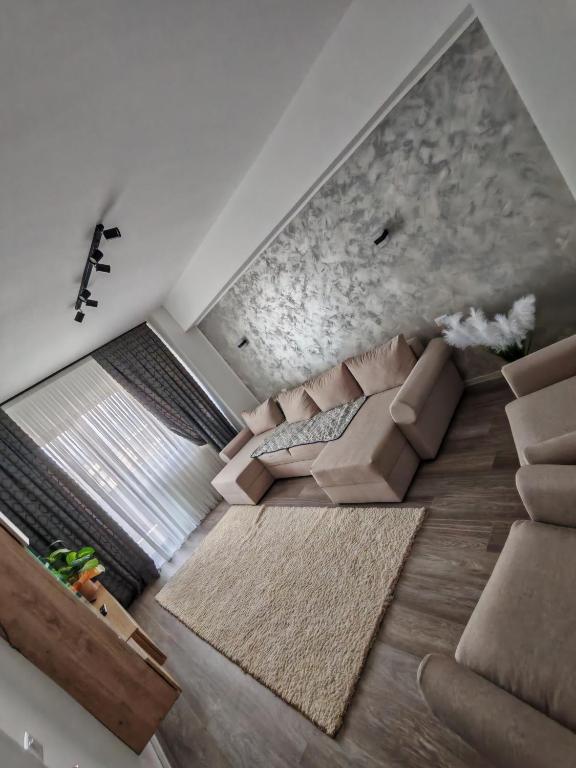 an overhead view of a living room with a couch at Apartament Dem Rădulescu, Rm Vâlcea in Troian